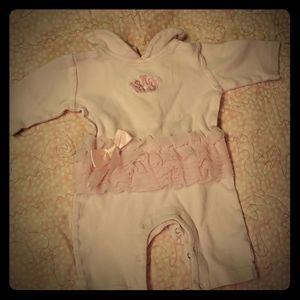 Pink baby bodysuit with waist ruffle